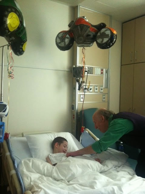Jackson visiting a boy at  his hospital bed